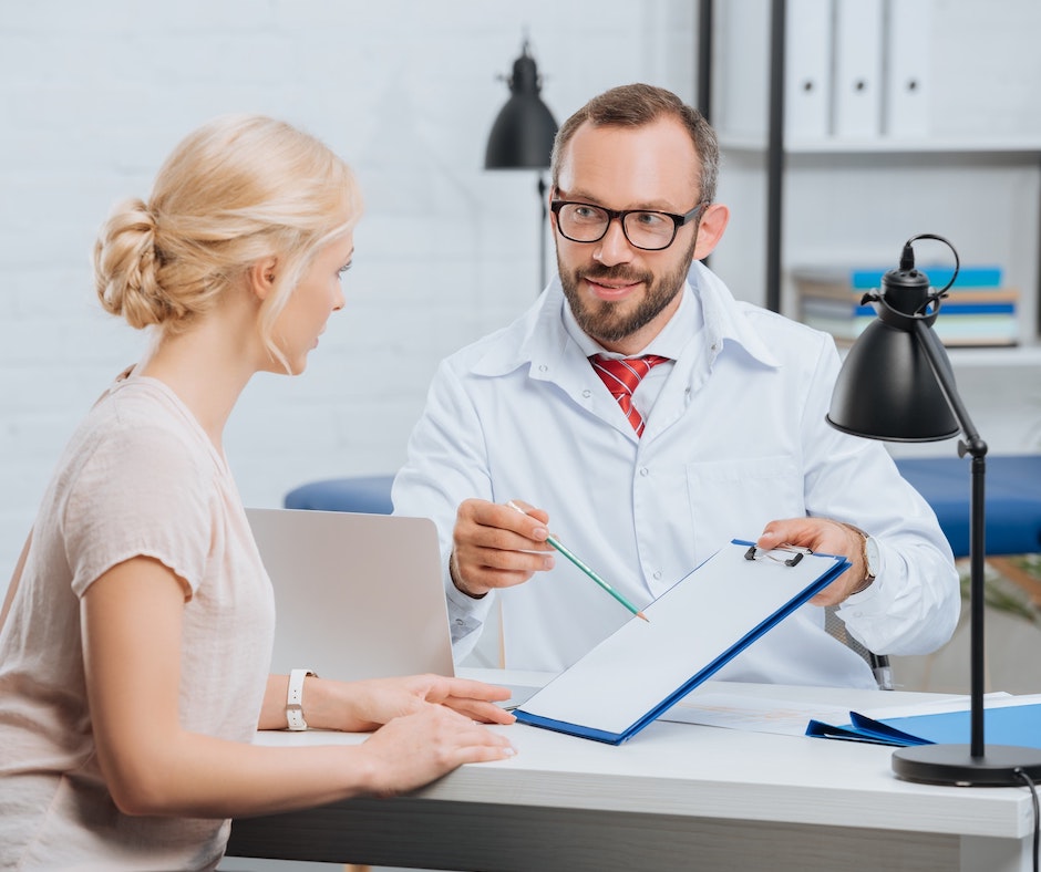 Image of a female having a conversation with a chiropractor